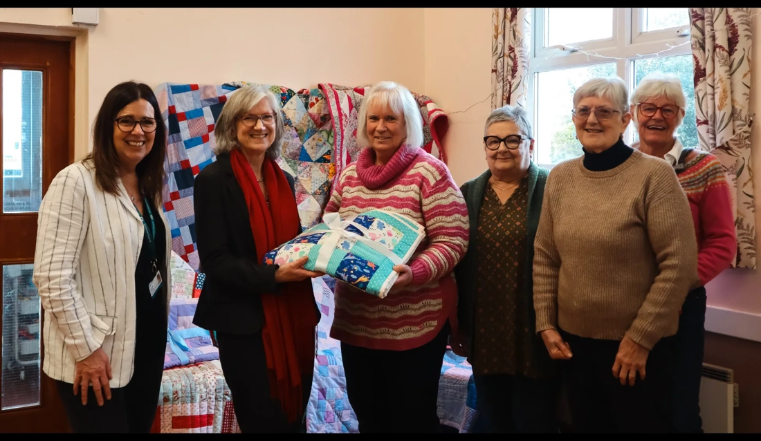 Local stitching group gift handmade blankets to children in care